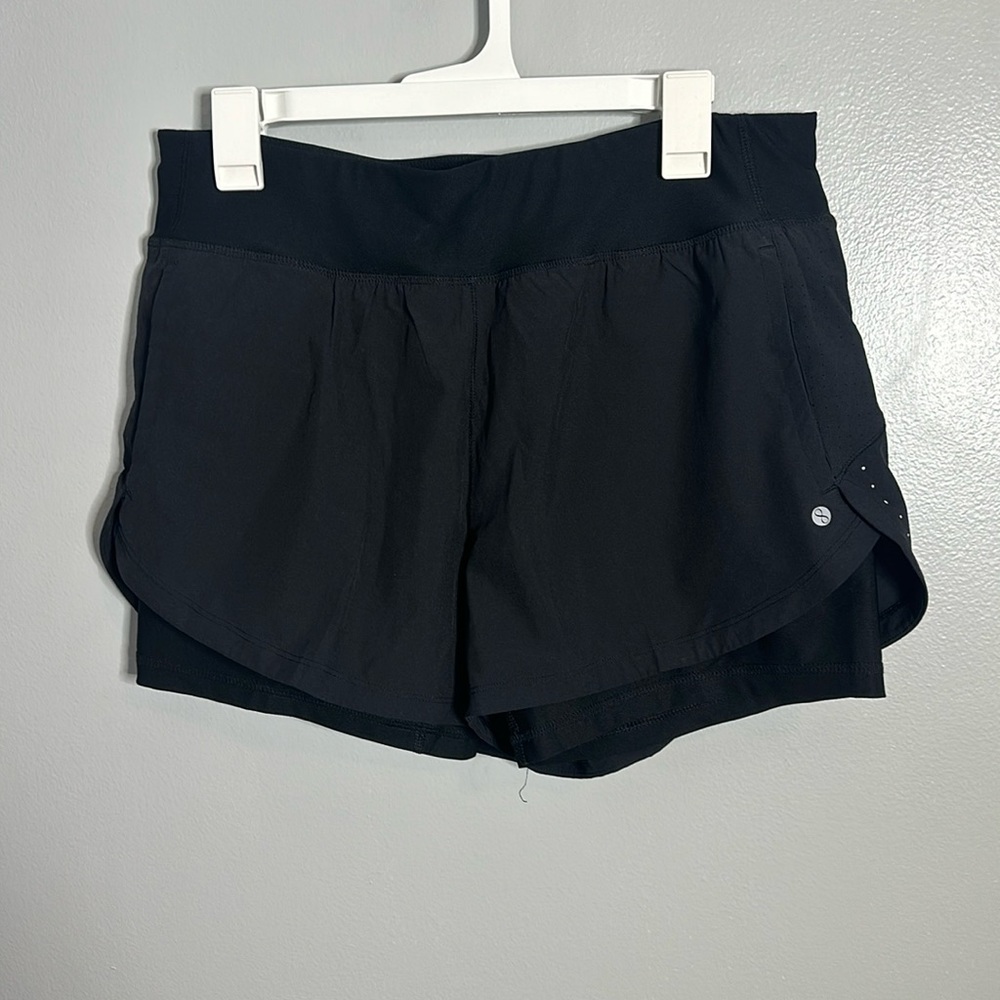 Color is black, has been worn, athletic shorts